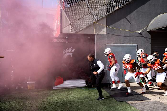 Cincinnati Bearcats head coach Luke Fickell takes the field before the NCAA Football game between the Cincinnati Bearcats and the South Florida Bulls at Nippert Stadium in Cincinnati on Saturday, Oct. 8, 2022. South Florida Bulls At Cincinnati Bearcats 156